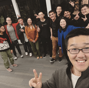 Orby AI team taking a selfie with Pear VC investor at the office